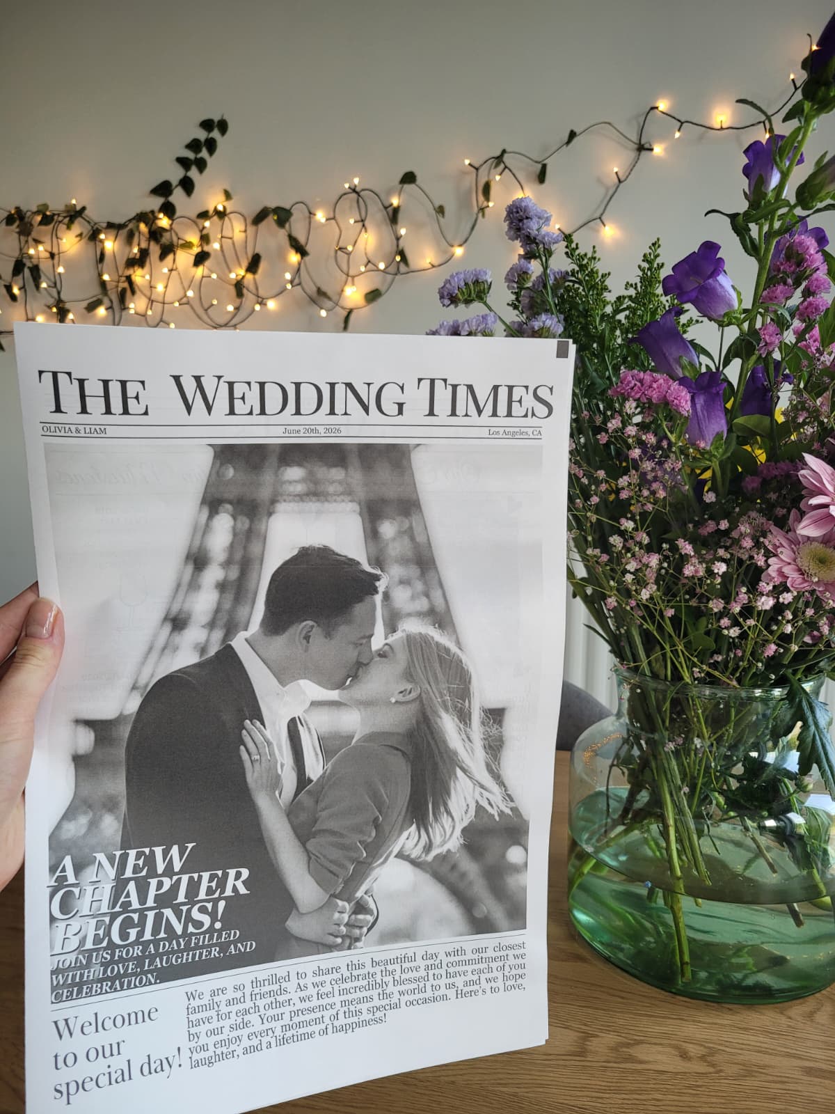 Elovaine wedding newspaper with flowers and fairy lights